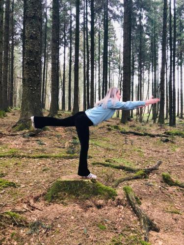 Practicing yoga in the woodland